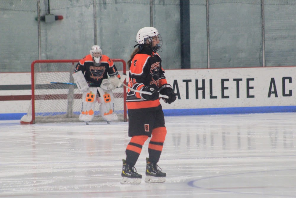 Makayla T. (#5) in the crease with a Bomber in front.