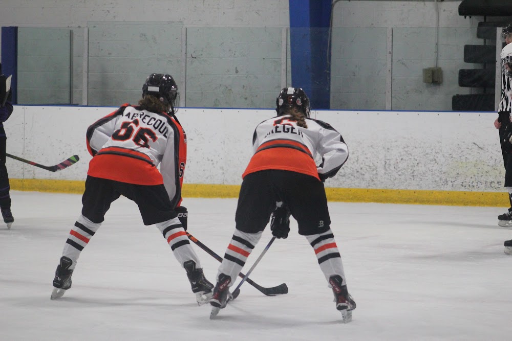 Claire L. (#66) and Violet G. holding the line.