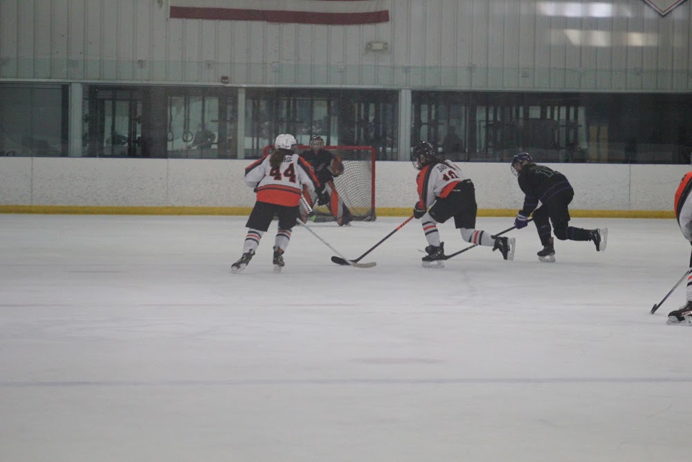 Maddie G. (#44) driving to the net.